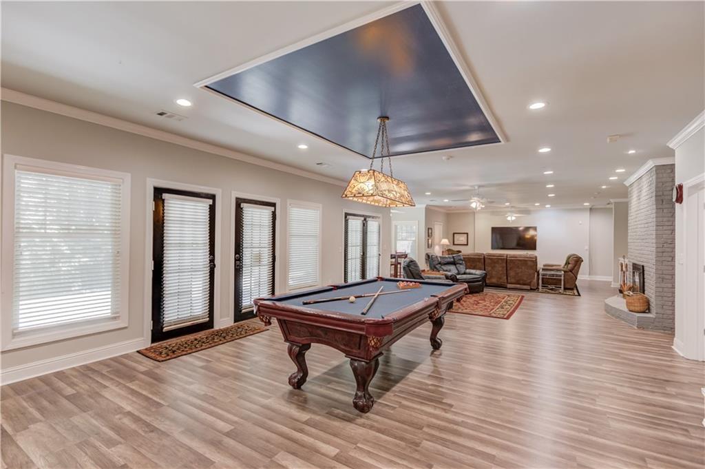 1345 Chandler Road Lawrenceville, GA 30045 - Photo 56 of 97 a room with lots of furniture and a wooden floor