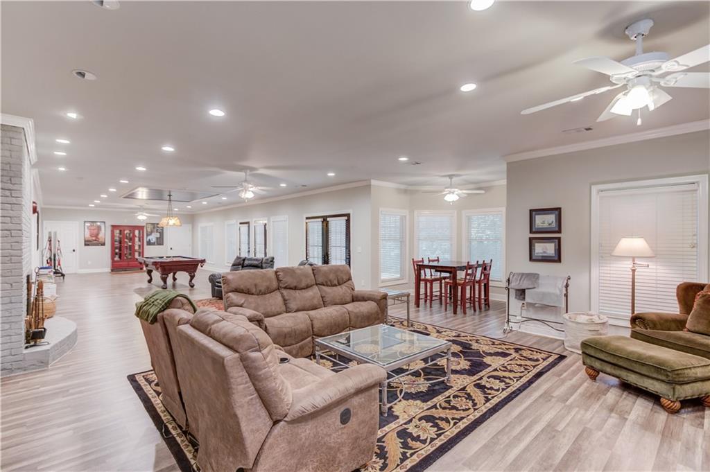 1345 Chandler Road Lawrenceville, GA 30045 - Photo 58 of 97 a living room with furniture and a wooden floor