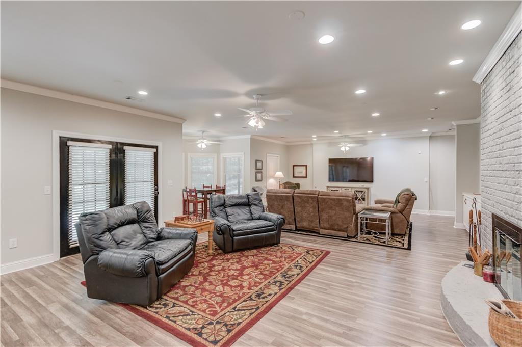 1345 Chandler Road Lawrenceville, GA 30045 - Photo 61 of 97 a living room with furniture and a wooden floor