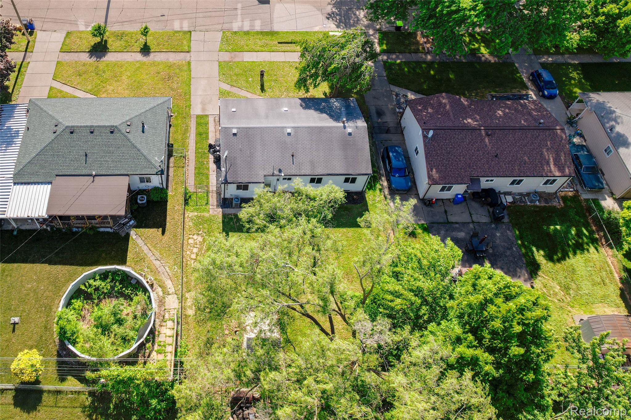 201 Cardwell Street Inkster, MI 48141 - Photo 40 of 41 Aerial perspective showcasing three residential properties with asphalt roofs