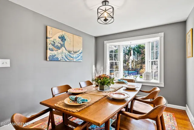 a view of a dining room with furniture window and outside view