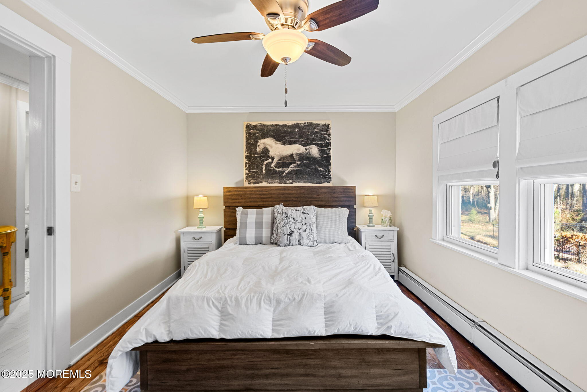 156 Old Tavern Road Farmingdale, NJ 07727 - Photo 25 of 43 a bedroom with a bed and a chandelier