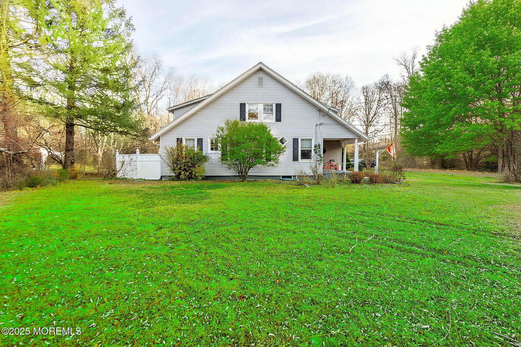 156 Old Tavern Road Farmingdale, NJ 07727 - Photo 3 of 43 a front view of house with a garden and trees