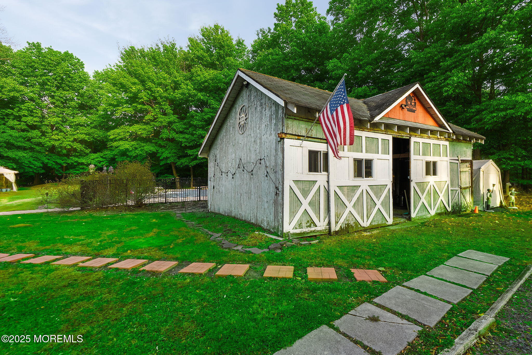 156 Old Tavern Road Farmingdale, NJ 07727 - Photo 4 of 43 a front view of a house with a yard and trees