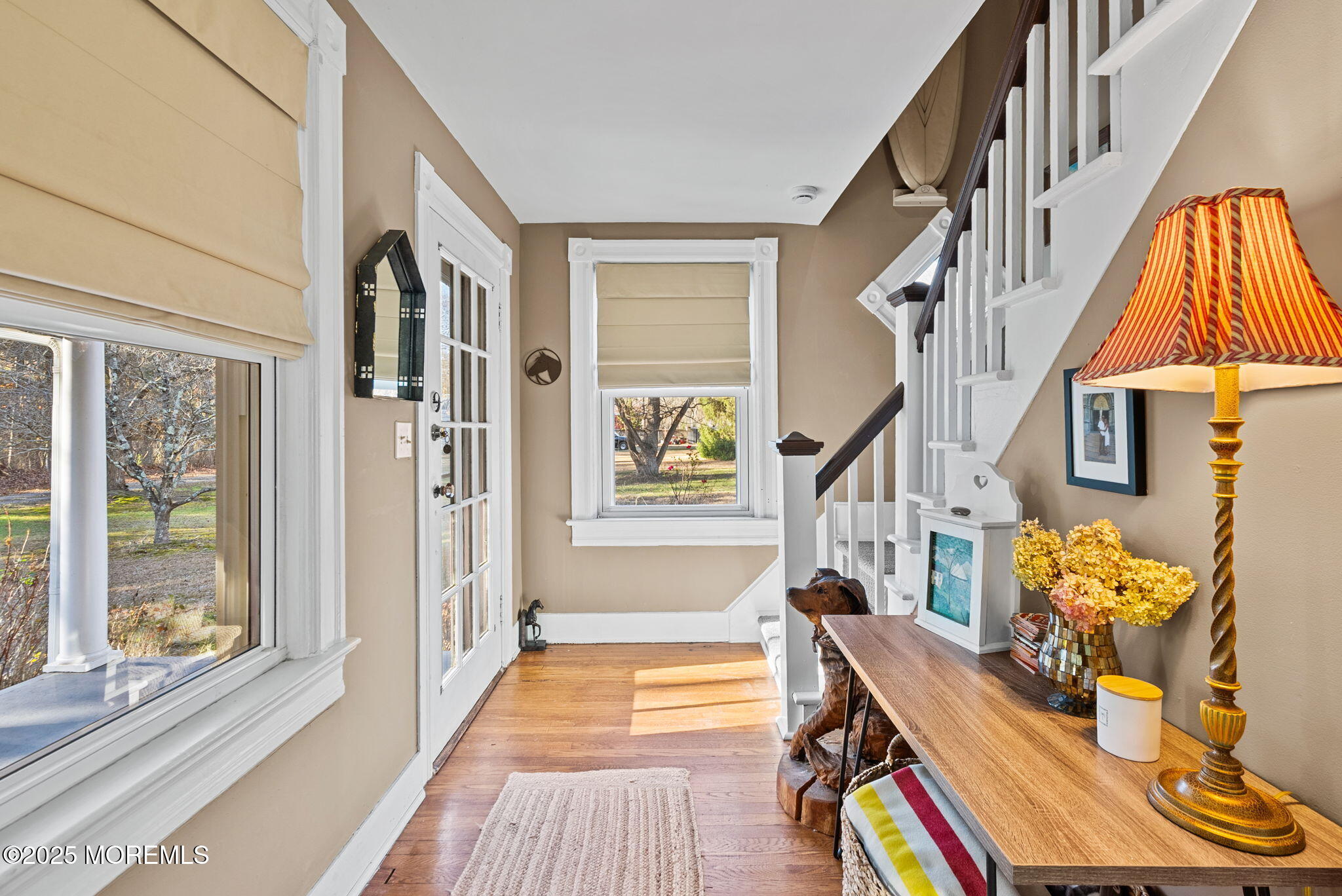 156 Old Tavern Road Farmingdale, NJ 07727 - Photo 8 of 43 a view of an entryway with wooden floor and windows