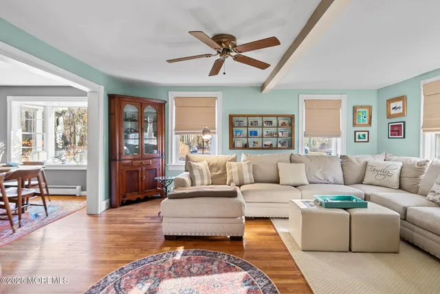a living room with furniture and a rug