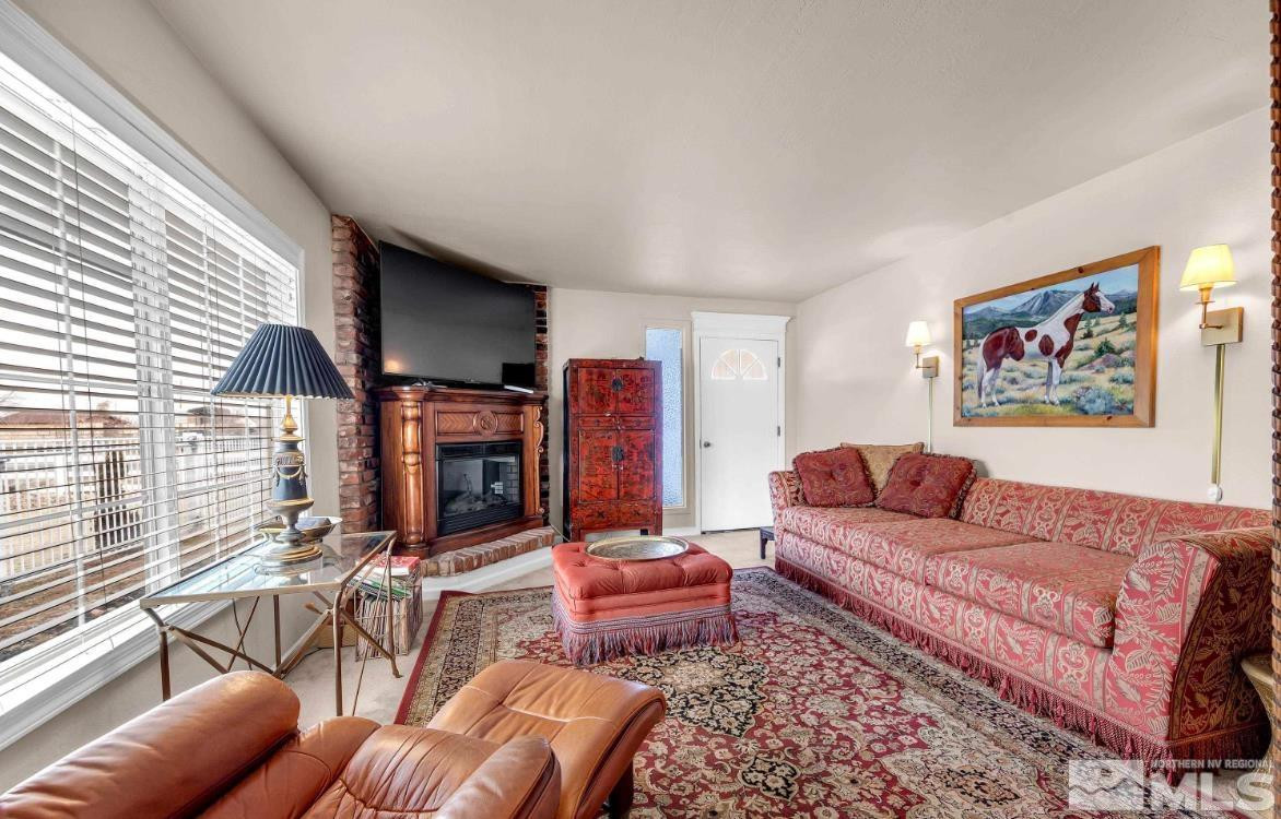 990 Riverview Drive Gardnerville, NV 89460 - Photo 12 of 40 a living room with furniture and a fireplace