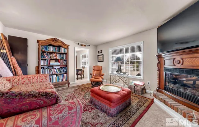 a bedroom with furniture and a book shelf