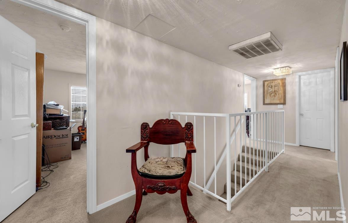 990 Riverview Drive Gardnerville, NV 89460 - Photo 24 of 40 a view of a hallway with seating area