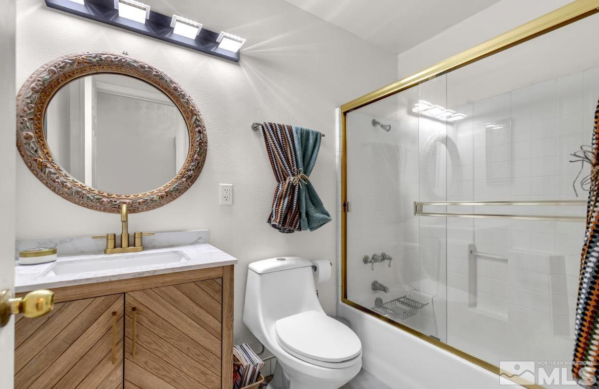 990 Riverview Drive Gardnerville, NV 89460 - Photo 29 of 40 a bathroom with a sink a toilet and shower