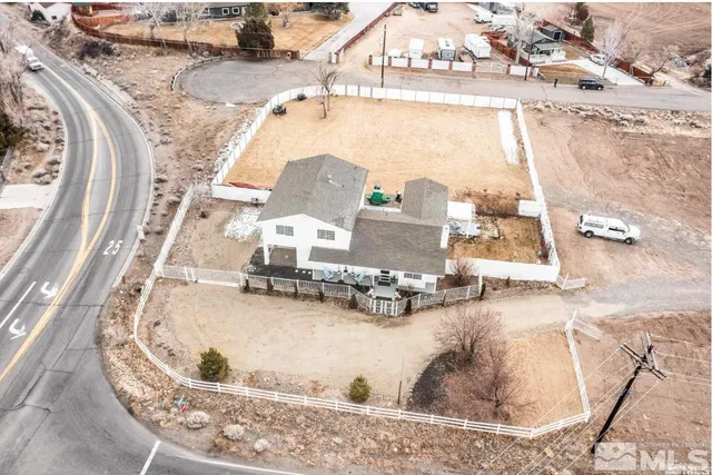 an aerial view of a house with swimming pool