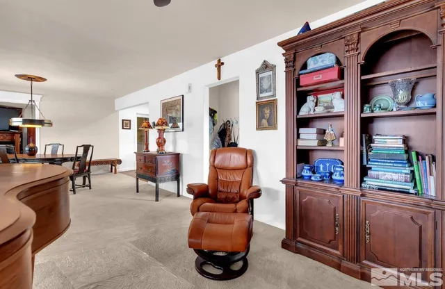 a view of living room with furniture and wooden floor