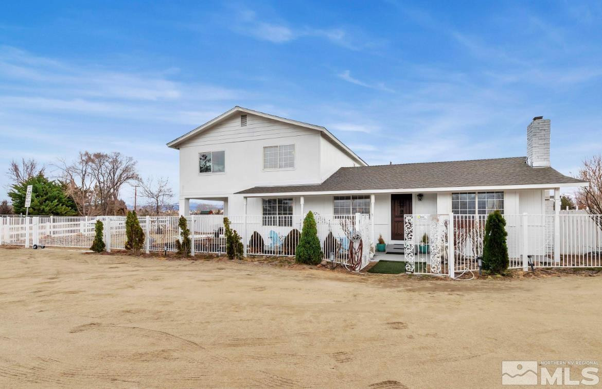 990 Riverview Drive Gardnerville, NV 89460 - Photo 5 of 40 a front view of a house with a outdoor seating
