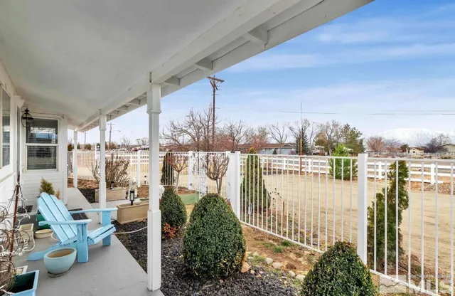 a balcony with chairs