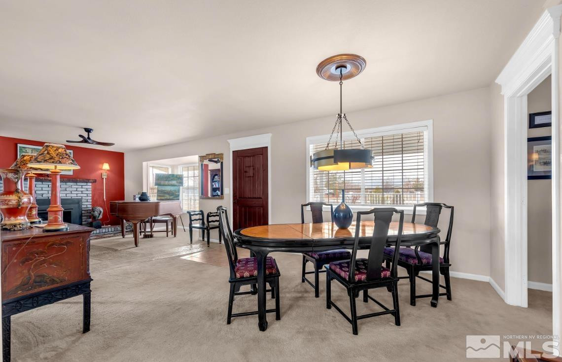 990 Riverview Drive Gardnerville, NV 89460 - Photo 7 of 40 a view of a dining room with furniture window and outside view