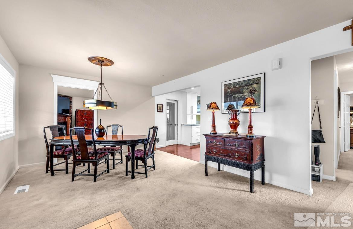 990 Riverview Drive Gardnerville, NV 89460 - Photo 9 of 40 a view of a dining room with furniture