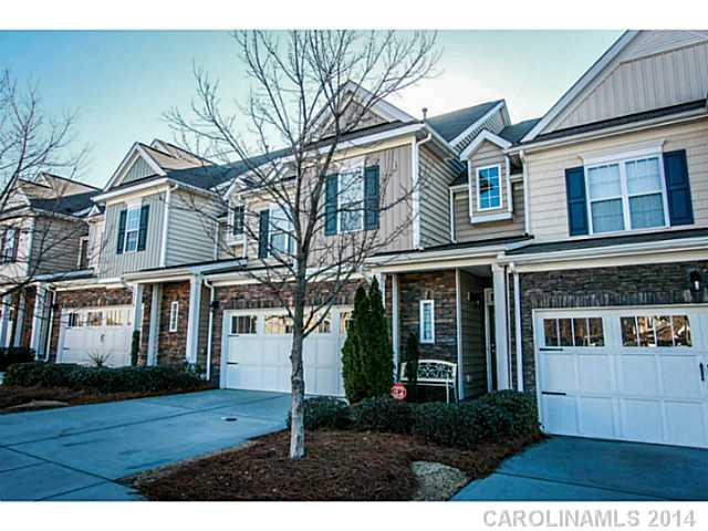 12106 Red Rust Lane Charlotte, NC 28277 - Photo 1 of 16 a front view of a house with a garden