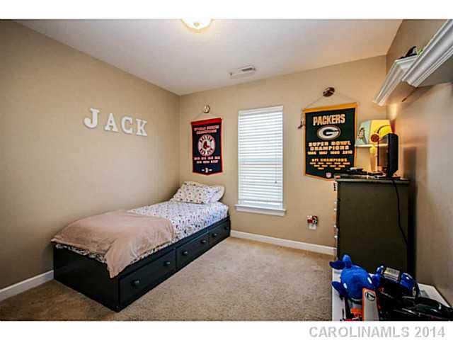 12106 Red Rust Lane Charlotte, NC 28277 - Photo 11 of 16 a bedroom with a bed and a flat screen tv