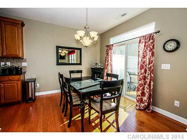 12106 Red Rust Lane Charlotte, NC 28277 - Photo 5 of 16 a view of a dining room with furniture and chandelier