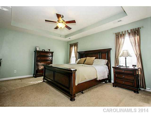 12106 Red Rust Lane Charlotte, NC 28277 - Photo 6 of 16 a bedroom with a bed dresser and a window