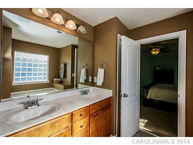 12106 Red Rust Lane Charlotte, NC 28277 - Photo 7 of 16 a bathroom with a sink double vanity and a mirror