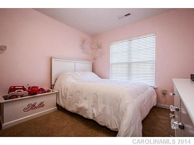 12106 Red Rust Lane Charlotte, NC 28277 - Photo 10 of 16 a bedroom with a bed and a dresser