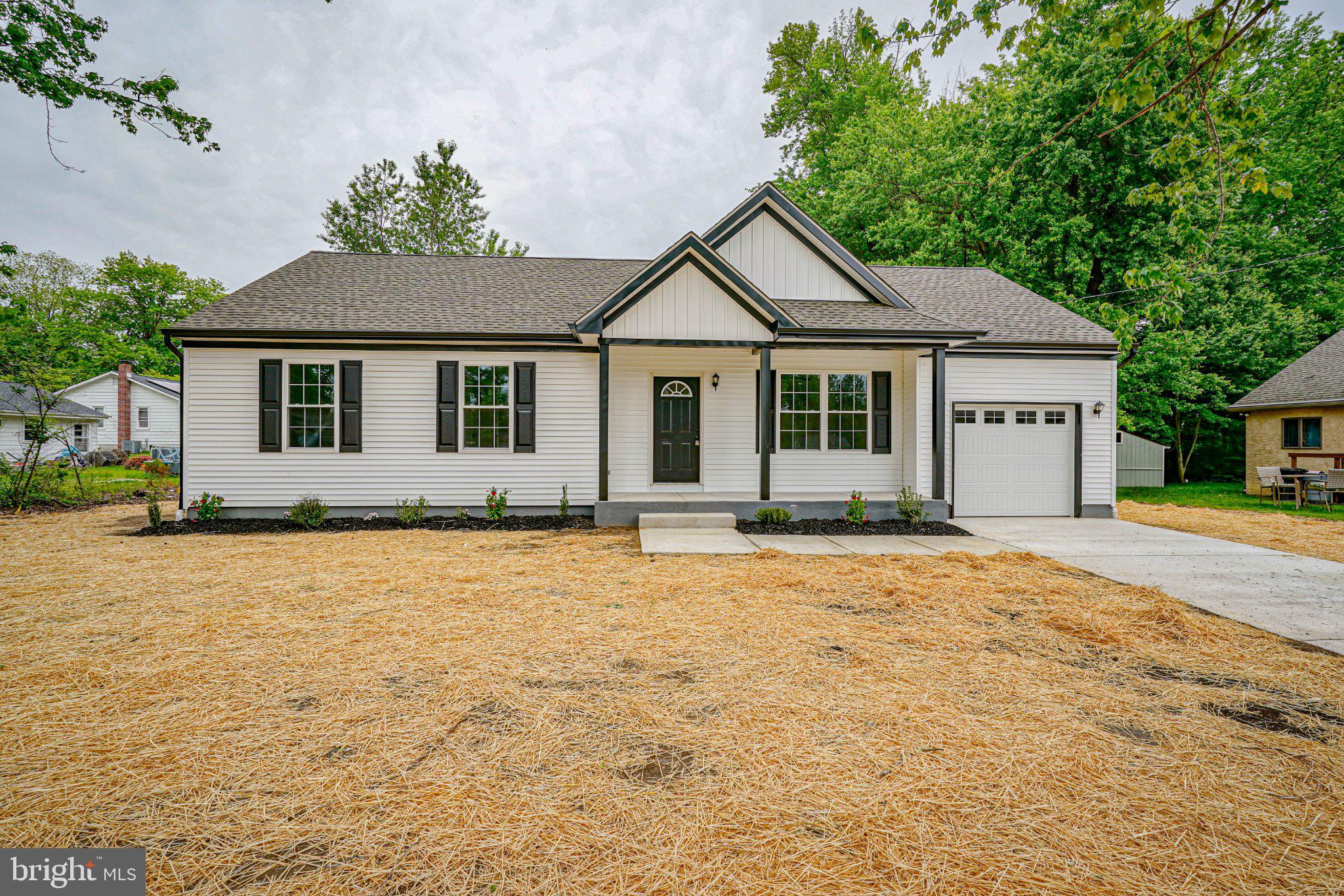 12 Park Road Pennsville, NJ 08070 - Photo 1 of 33 Charming home with lush greenery backdrop.