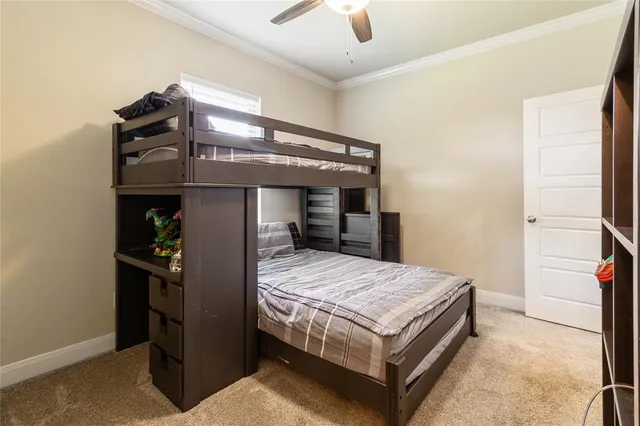 a bedroom with a bed and a mirror