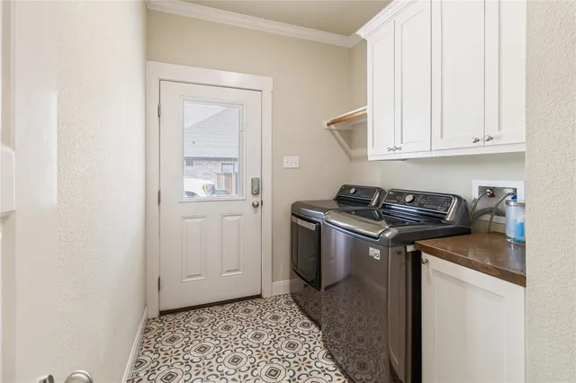 a utility room with granite countertop a sink and a stove top oven