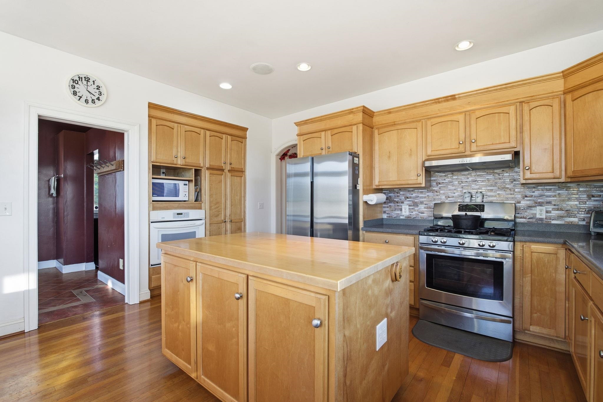 436 Chimney Rock Road Earlysville, VA 22936 - Photo 15 of 61 a kitchen with stainless steel appliances granite countertop a sink stove and refrigerator