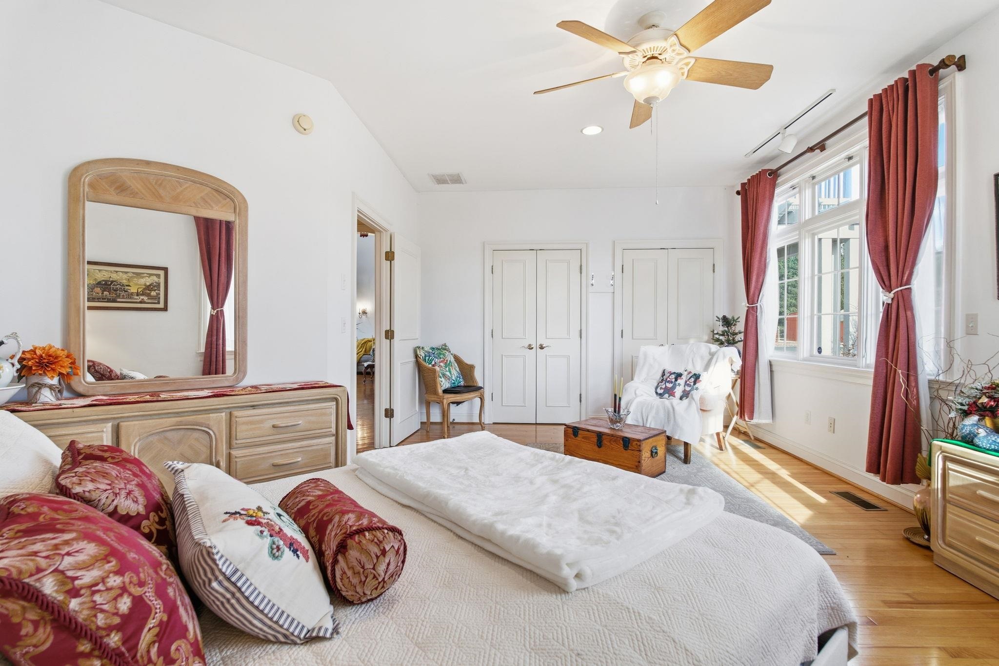 436 Chimney Rock Road Earlysville, VA 22936 - Photo 20 of 61 a bedroom with a bed and a chandelier