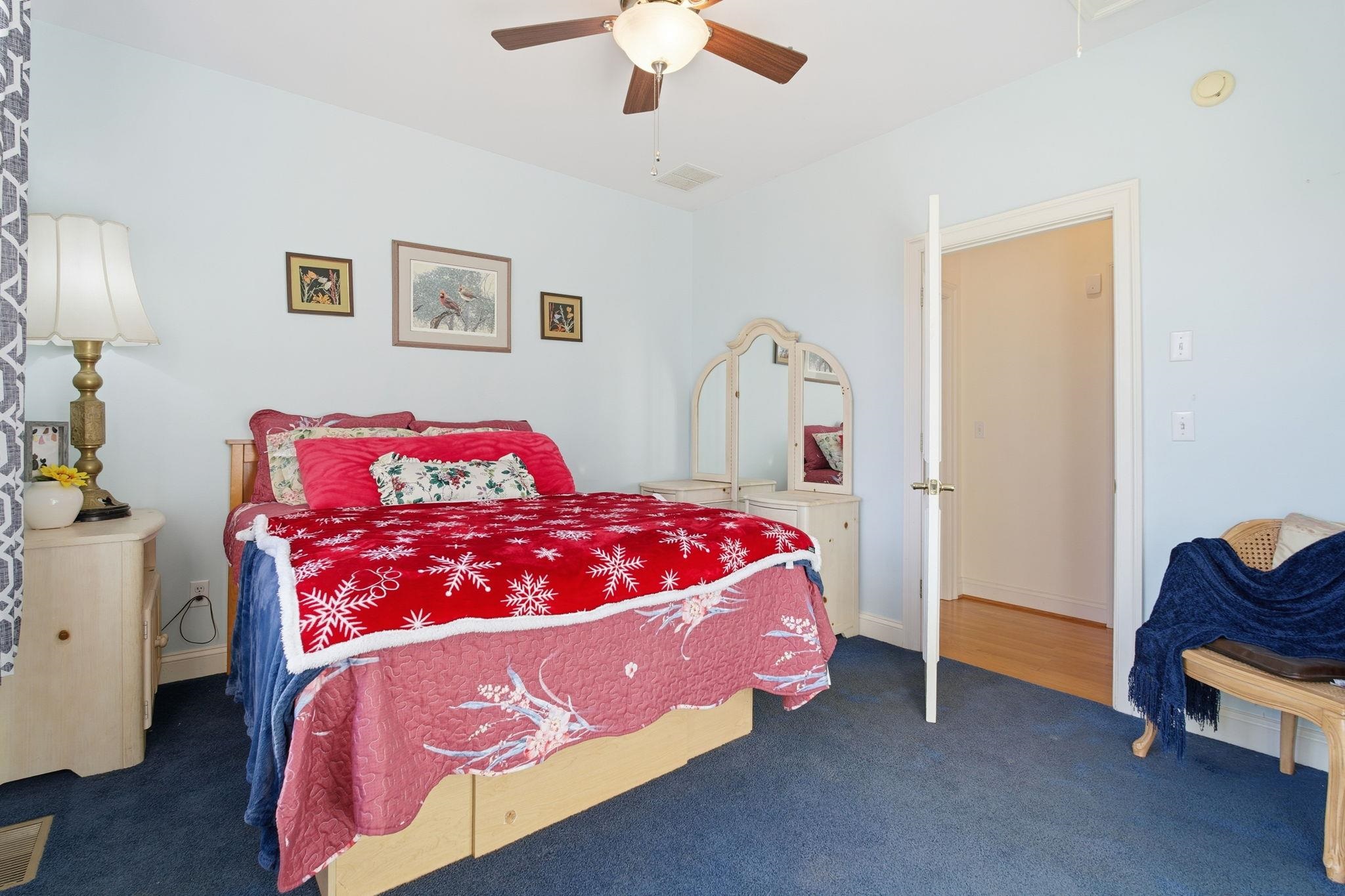 436 Chimney Rock Road Earlysville, VA 22936 - Photo 21 of 61 a bedroom with a bed and a chandelier