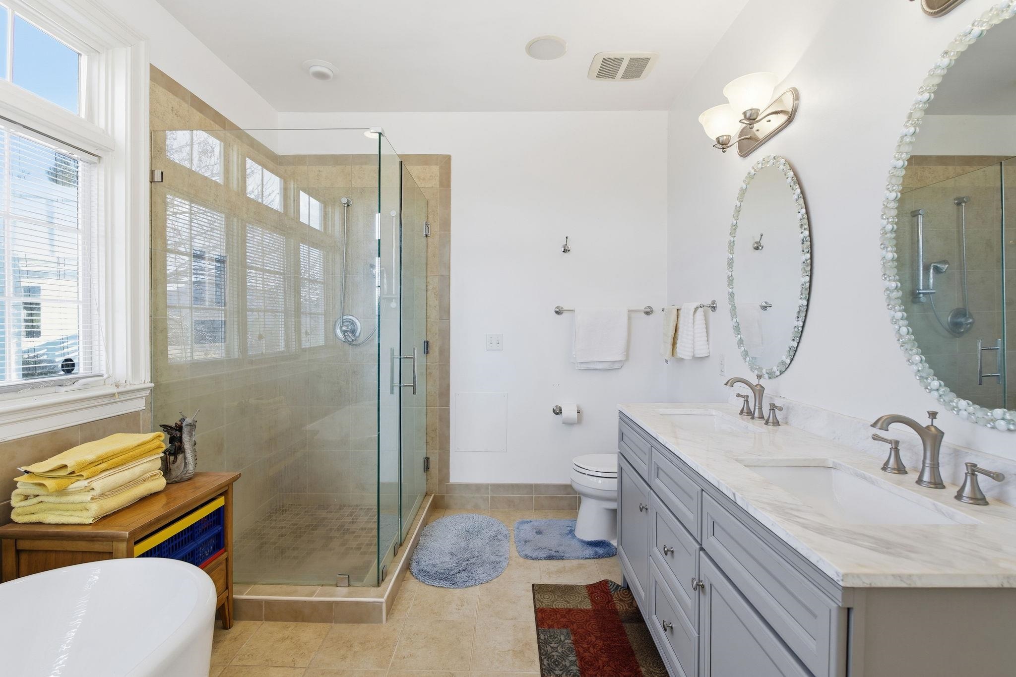 436 Chimney Rock Road Earlysville, VA 22936 - Photo 29 of 61 a spacious bathroom with a double vanity sink toilet and shower