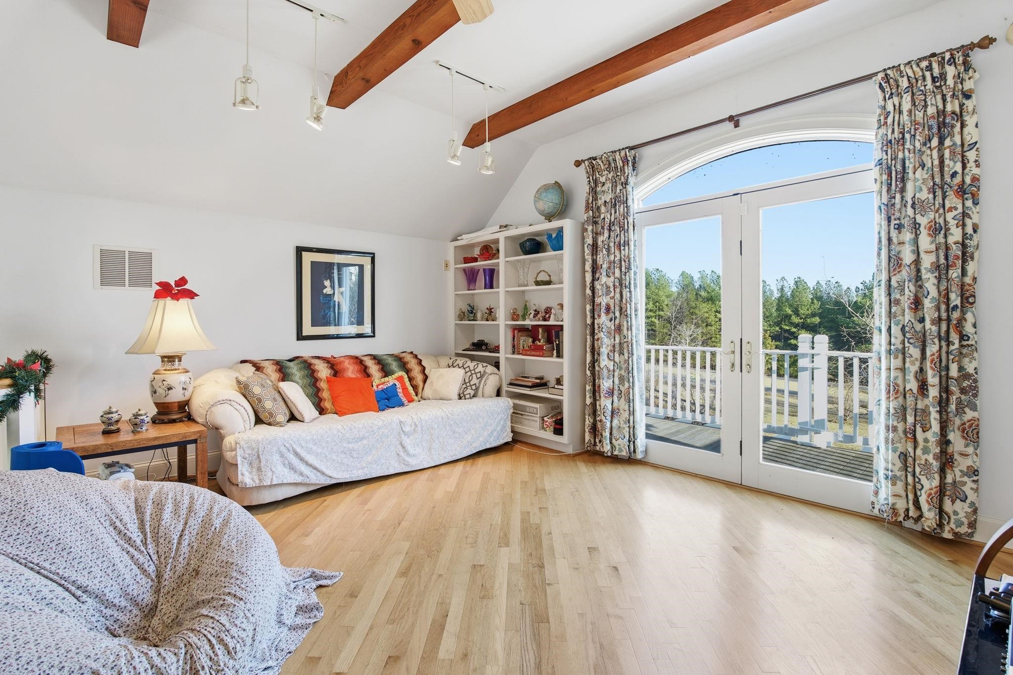 436 Chimney Rock Road Earlysville, VA 22936 - Photo 30 of 61 a living room with furniture and a flat screen tv