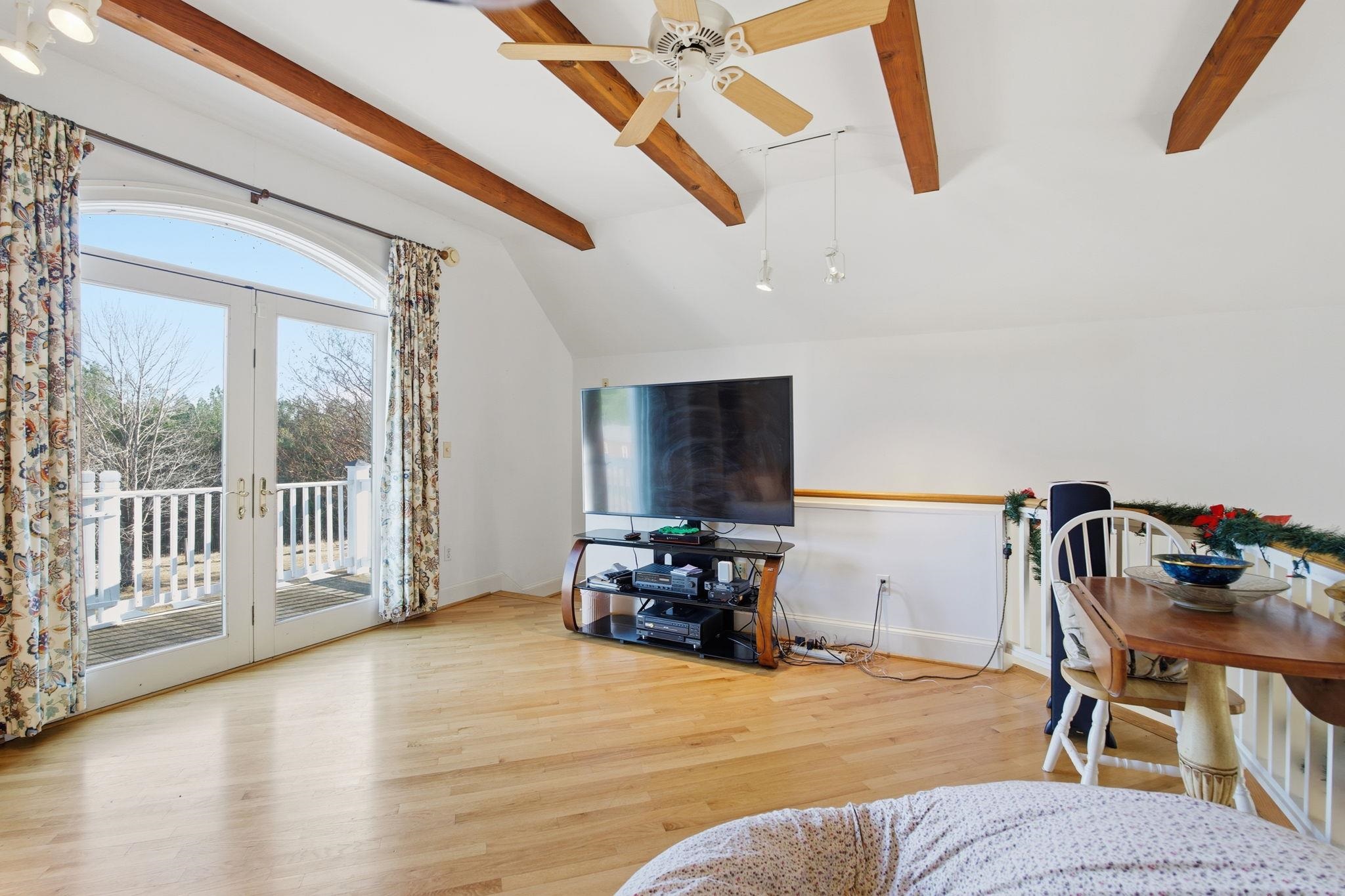 436 Chimney Rock Road Earlysville, VA 22936 - Photo 32 of 61 a living room with furniture and a flat screen tv