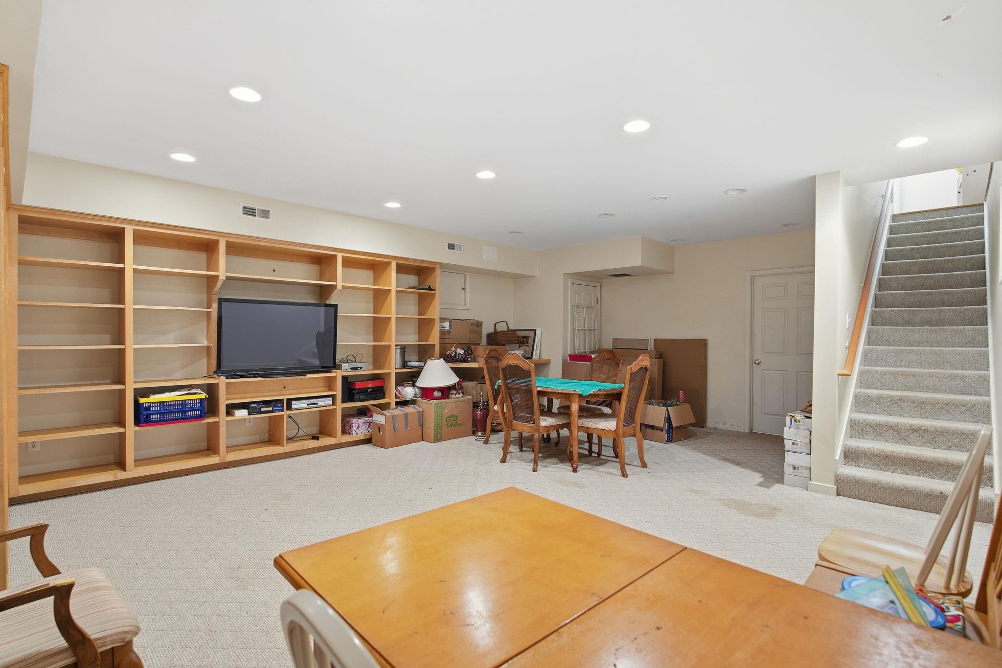 436 Chimney Rock Road Earlysville, VA 22936 - Photo 34 of 61 a living room with furniture a flat screen tv and kitchen view