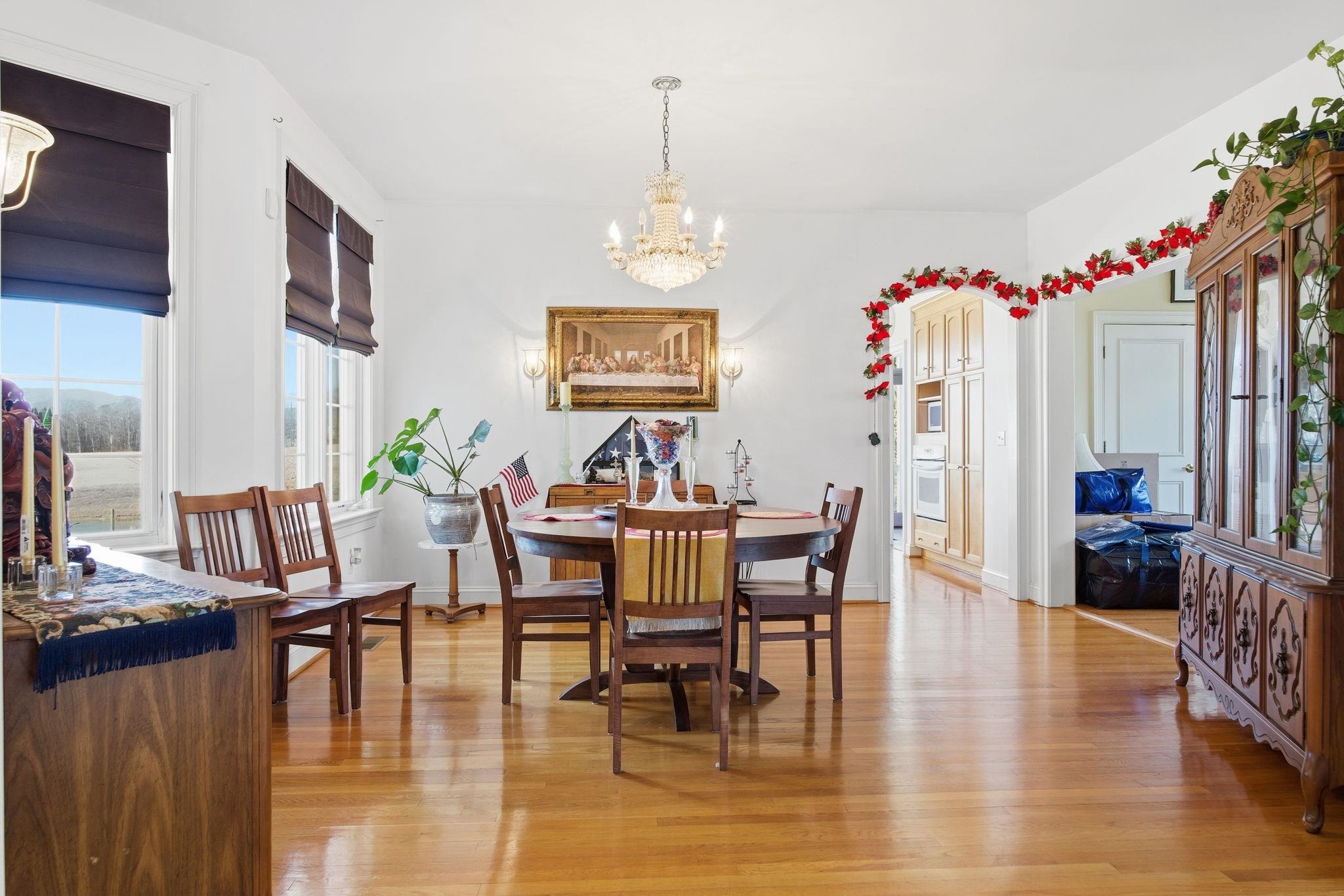 436 Chimney Rock Road Earlysville, VA 22936 - Photo 10 of 61 a view of a dining room with furniture window and wooden floor