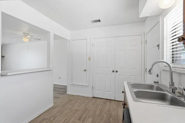 a bathroom with a sink and a large mirror