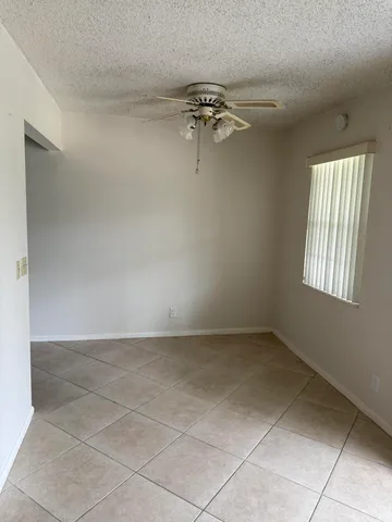 a room with wooden floor and shoes