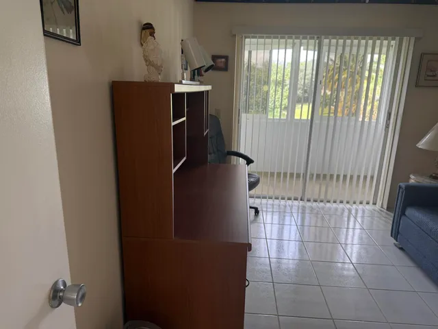 a bedroom with a bed and a chair