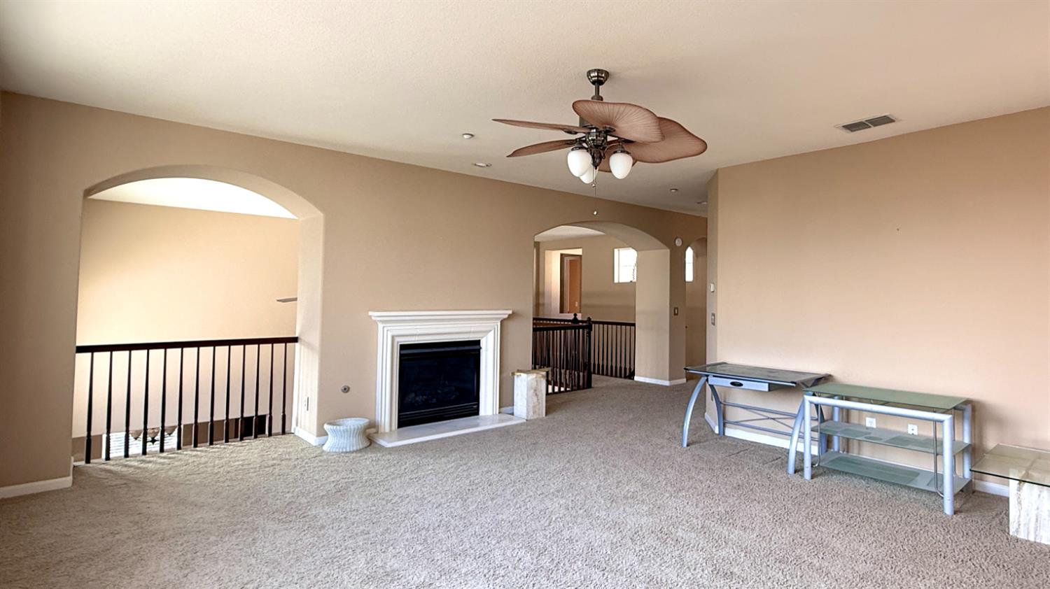 16206 Sand Bar Way Lathrop, CA 95330 - Photo 16 of 32 a view of a livingroom with a fireplace a chandelier and windows