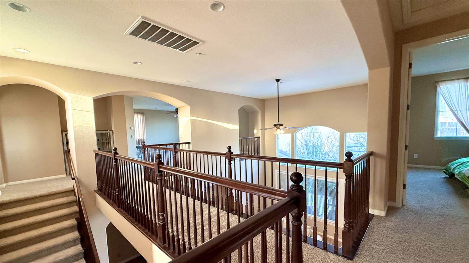 16206 Sand Bar Way Lathrop, CA 95330 - Photo 18 of 32 a view of staircase with railing and a chandelier