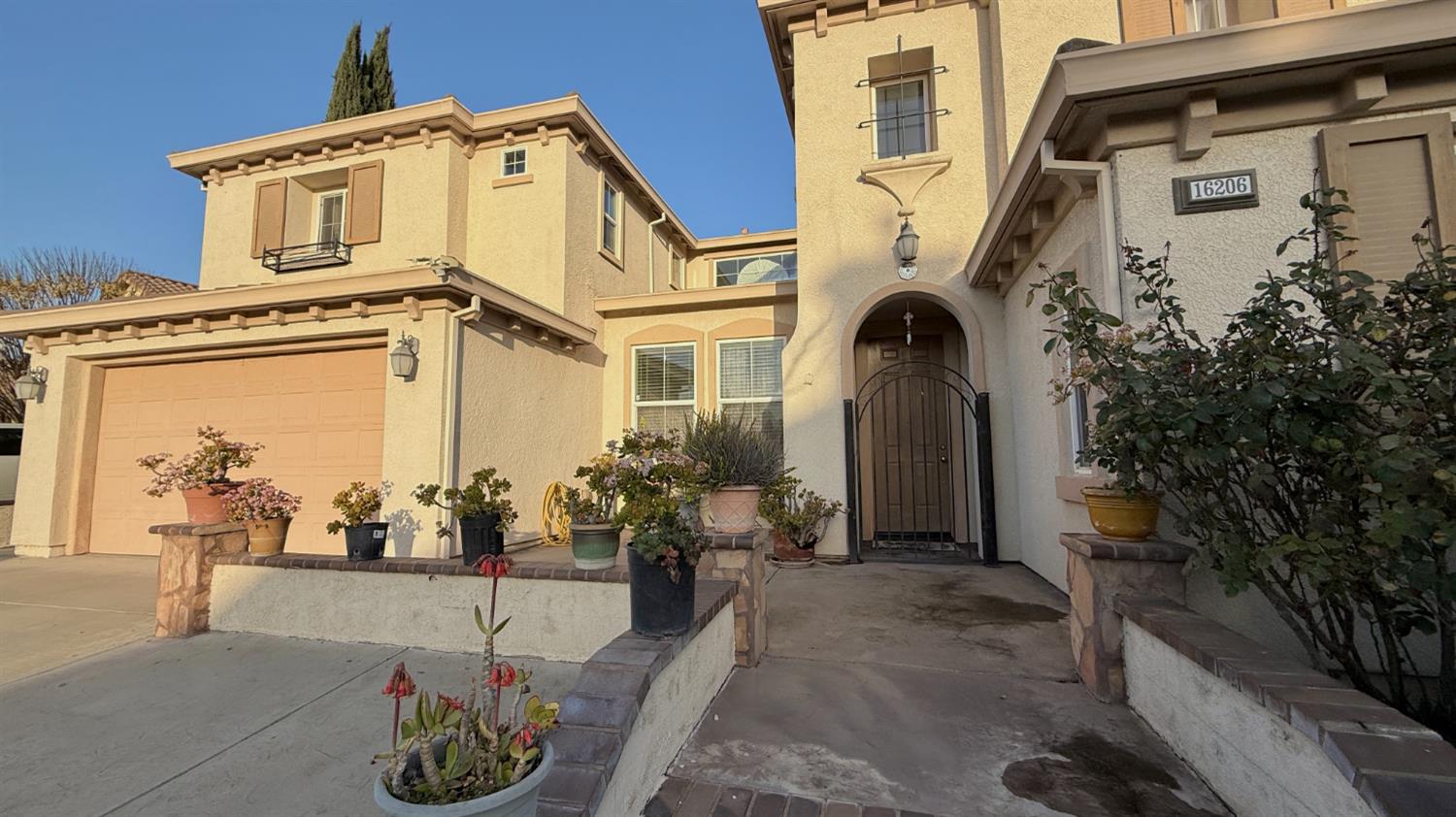 16206 Sand Bar Way Lathrop, CA 95330 - Photo 2 of 32 a front view of a house with patio