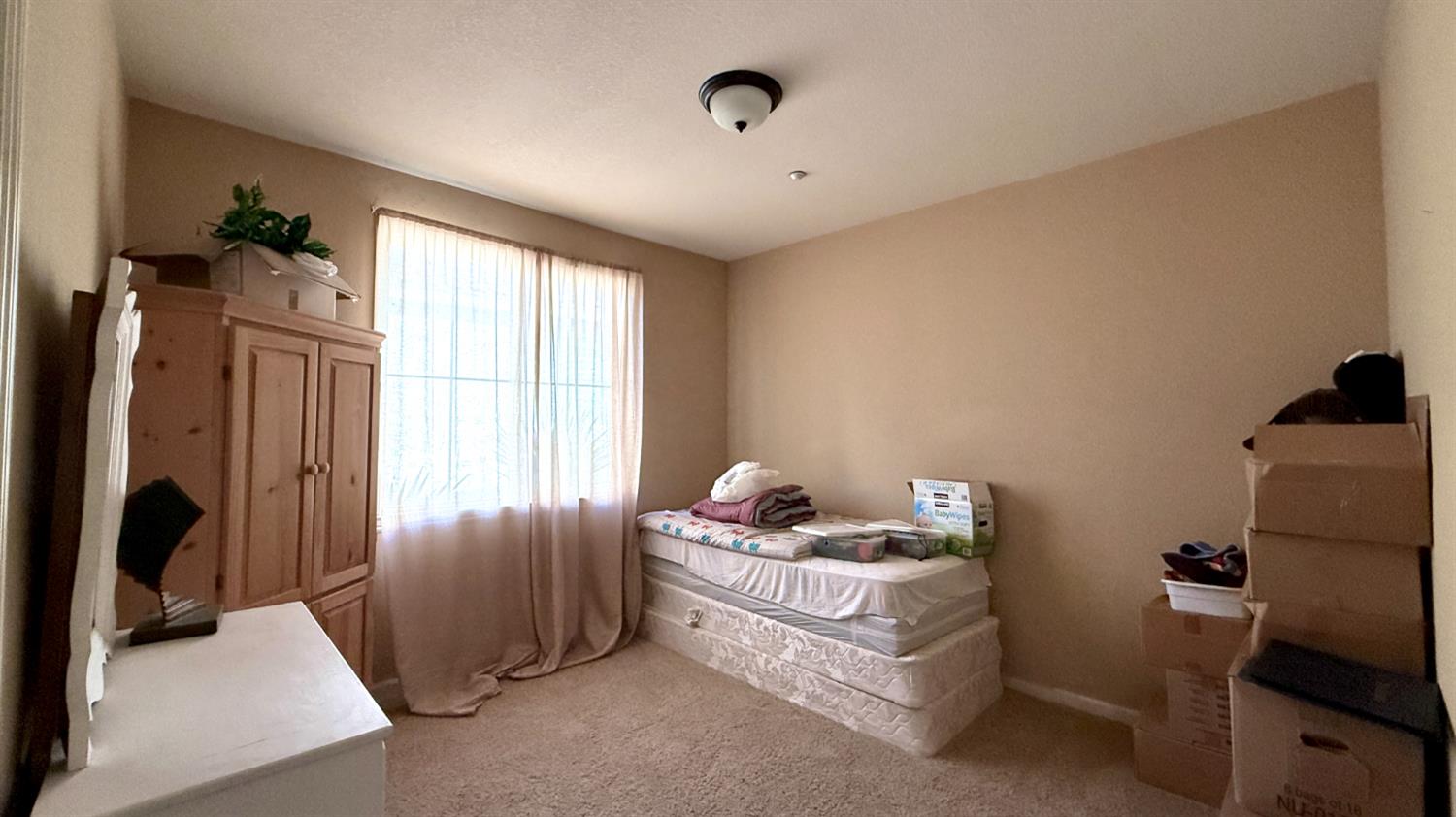 16206 Sand Bar Way Lathrop, CA 95330 - Photo 23 of 32 a bed room with furniture and a window
