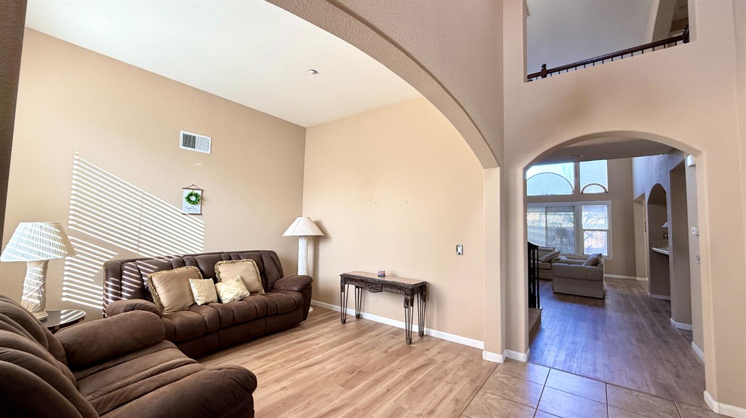 16206 Sand Bar Way Lathrop, CA 95330 - Photo 5 of 32 a living room with furniture and a wooden floor