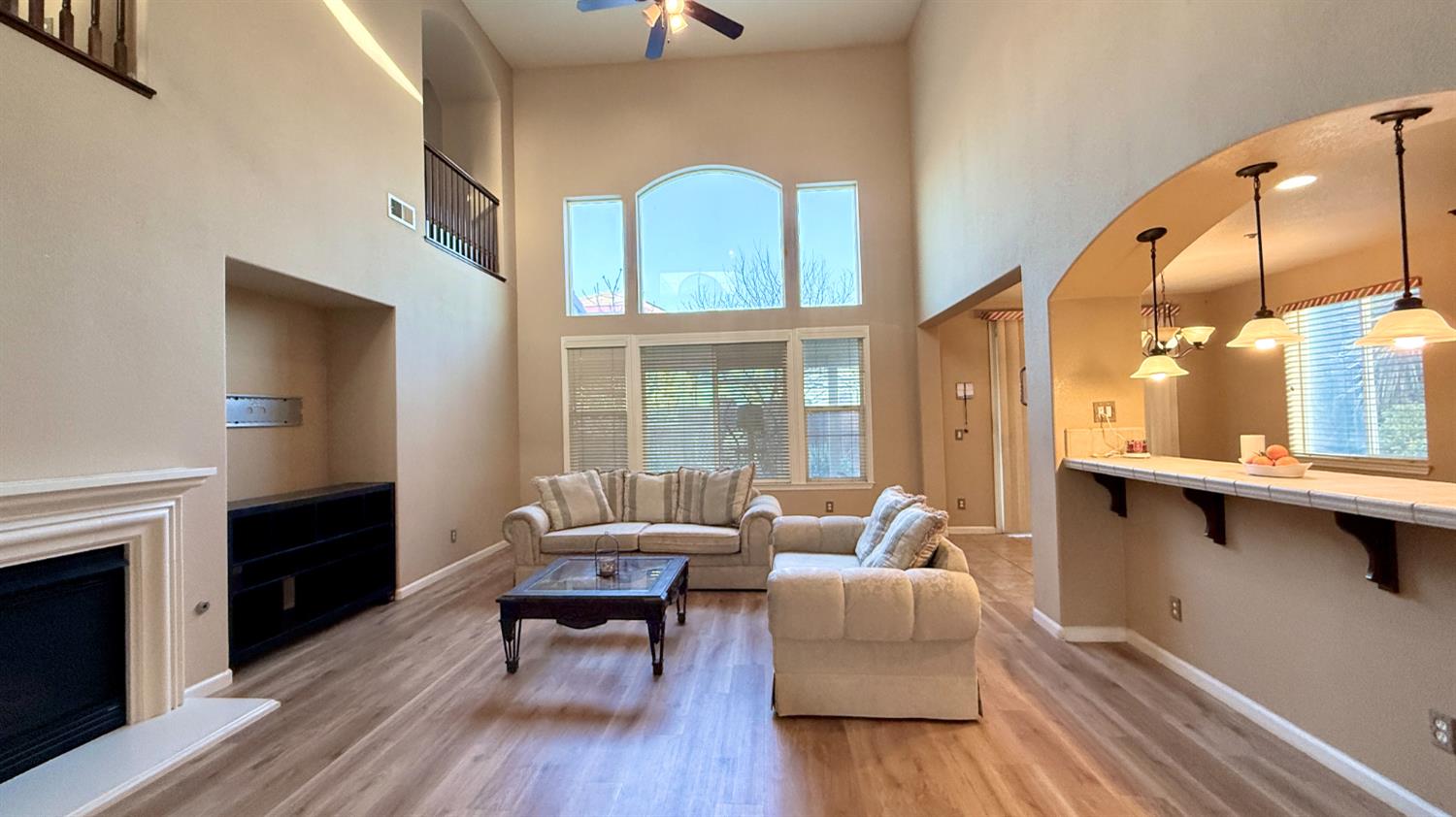 16206 Sand Bar Way Lathrop, CA 95330 - Photo 6 of 32 a living room with furniture fireplace and wooden floor