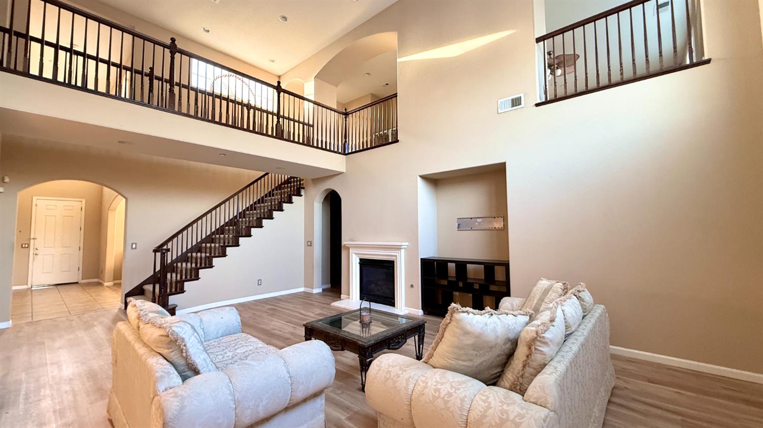 16206 Sand Bar Way Lathrop, CA 95330 - Photo 8 of 32 a living room with furniture and a fireplace