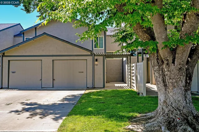 a house with a tree in front of it