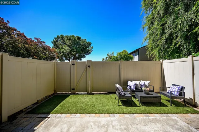 a backyard of a house with lots of green space