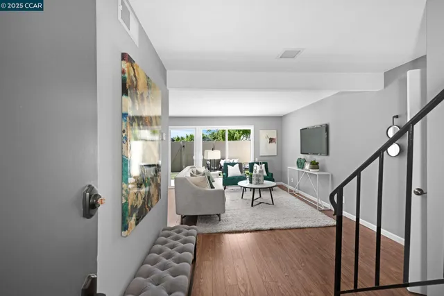 a living room with furniture and a table